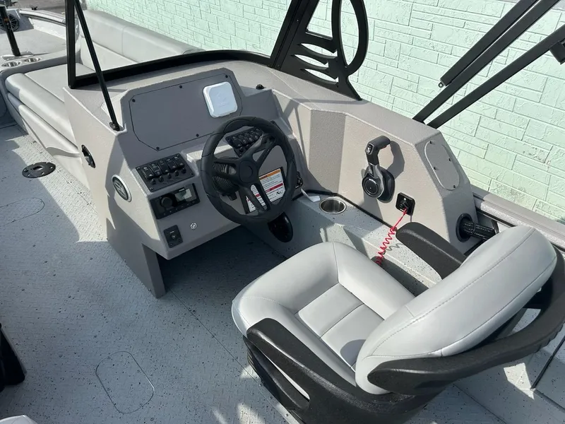Slide: The Image of 2025 SeaArk EasyCat boat interior with steering wheel and seating. - 5