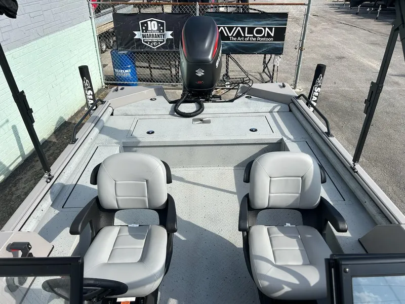 Slide: The Image of 2025 SeaArk EasyCat boat interior with dual seats and Suzuki outboard motor. - 6