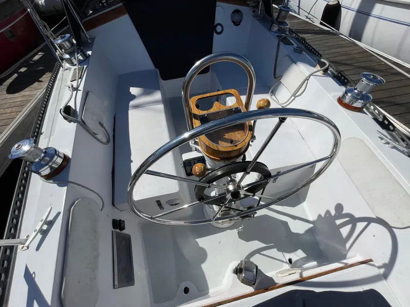 Slide: The Image of Cockpit of a 1980 Catalina 38 sailboat with steering wheel and winches. - 14