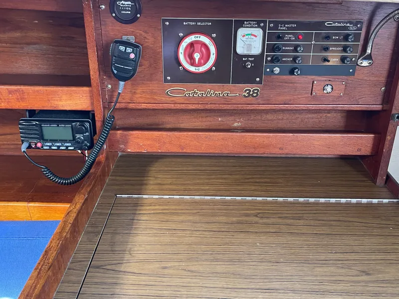 Slide: The Image of Control panel of a 1980 Catalina 38 sailboat with radio and battery selector. - 27