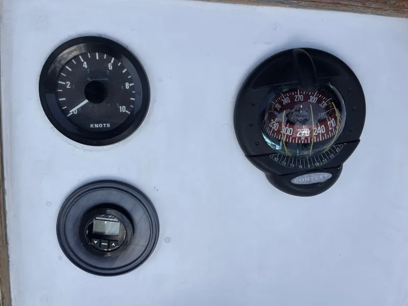 Slide: The Image of Boat dashboard with compass and speedometer, Catalina 38, 1980 model. - 31