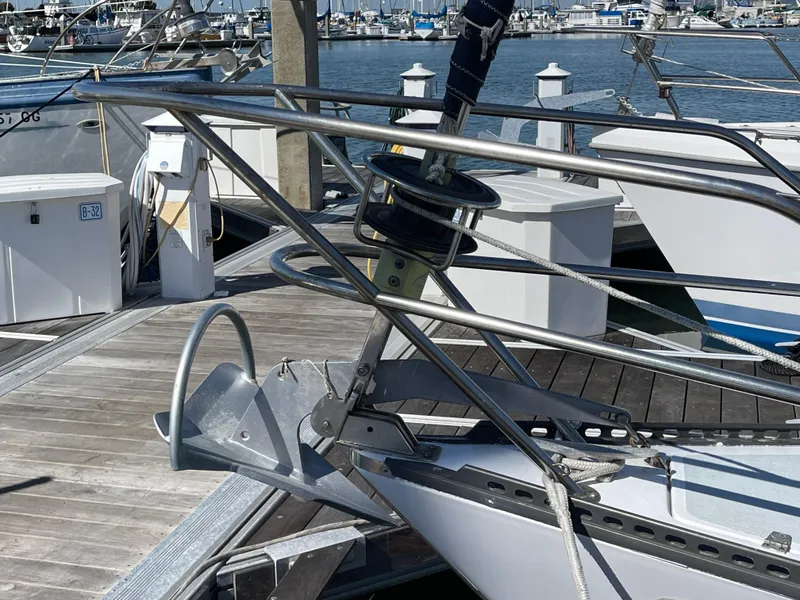 Slide: The Image of 1980 Catalina 38 sailboat bow with anchor at marina dock. - 34