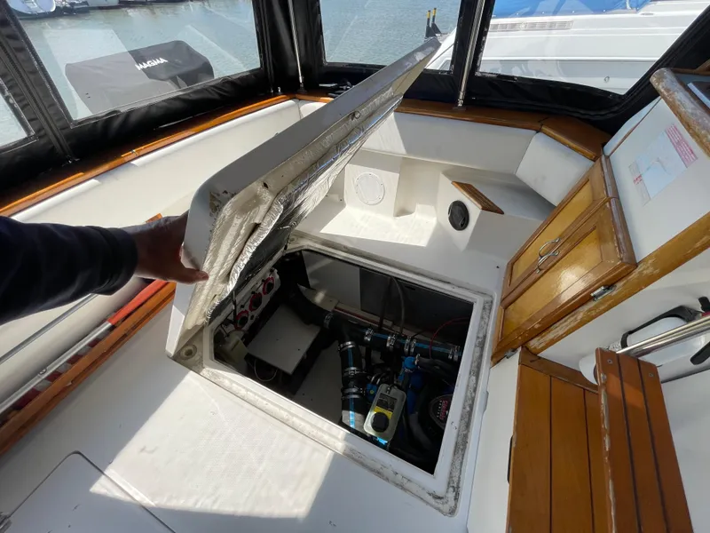 Slide: The Image of 1989 Bayliner 3288 boat interior showing engine compartment access. - 24