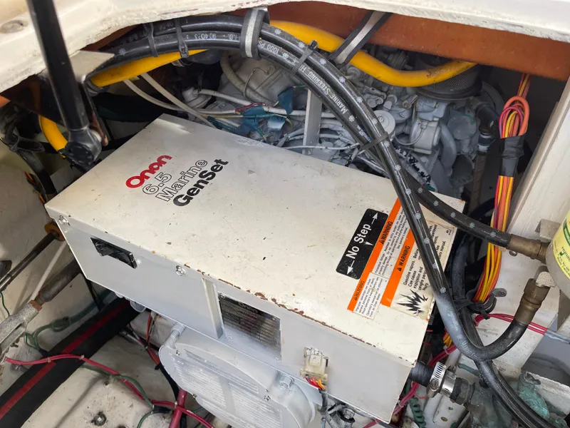 Slide: The Image of Engine compartment of a 1989 Bayliner 3288 with Onan Marine Genset. - 27