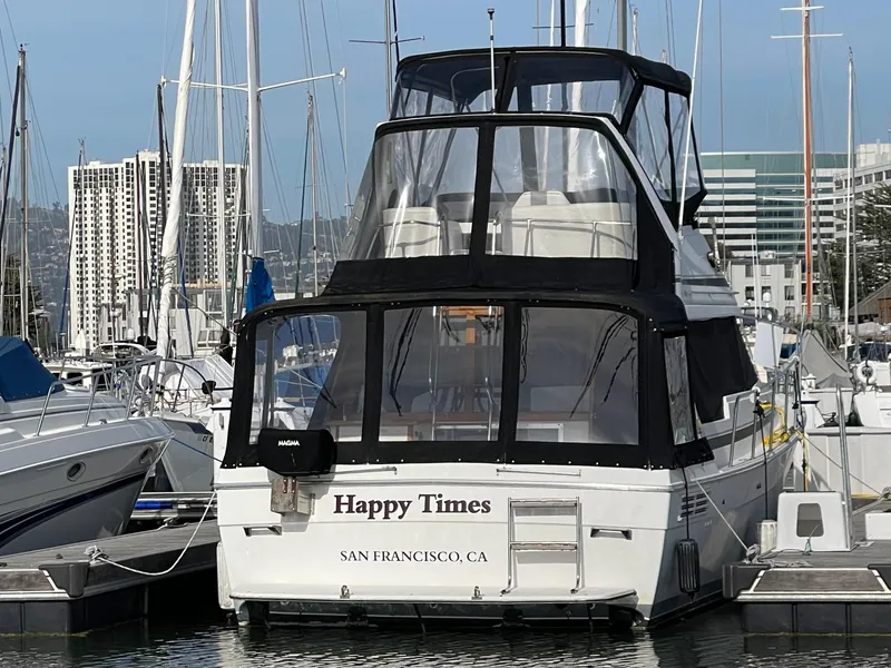 Slide: The Image of 1989 Bayliner 3288 yacht named "Happy Times" docked in San Francisco marina. - 31