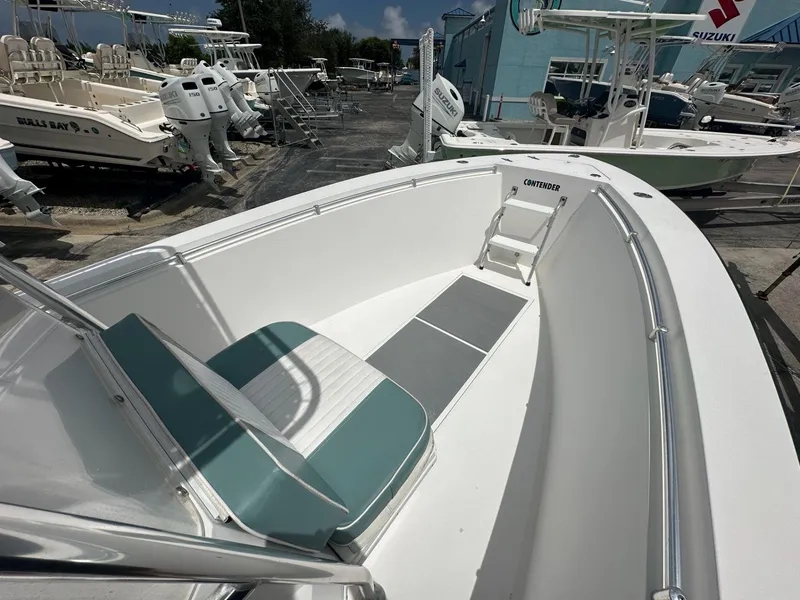 Slide: The Image of 2007 Contender 21 Open boat interior with seating, docked among other boats. - 5