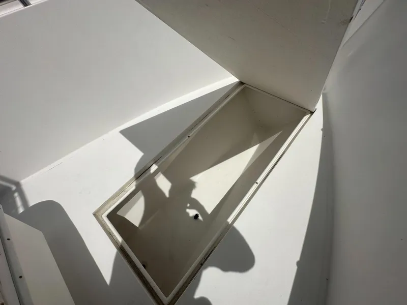 Slide: The Image of Open storage compartment on a 2007 Contender 21 Open boat. - 6