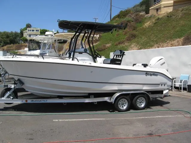 The Image of 2025 Edgewater 208 WATCHMAN CC boat on trailer, parked outdoors. - 1
