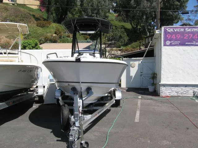 Slide: The Image of 2025 Edgewater 208 WATCHMAN CC boat on trailer in parking lot. - 12