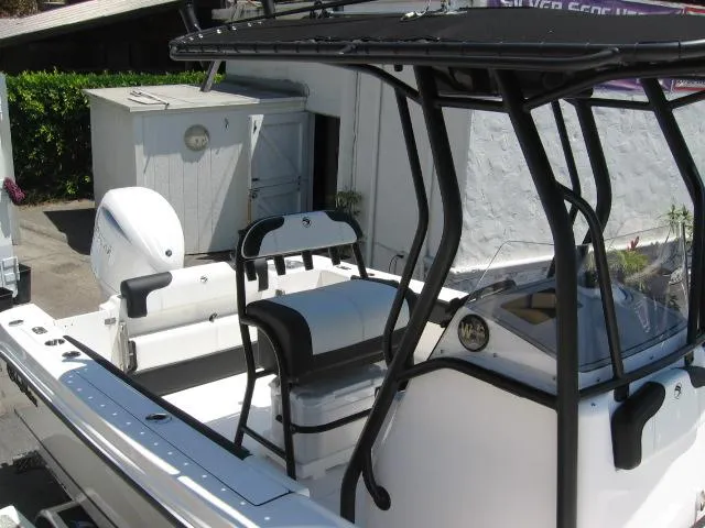 Slide: The Image of 2025 Edgewater 208 WATCHMAN CC boat interior with seating and console. - 4