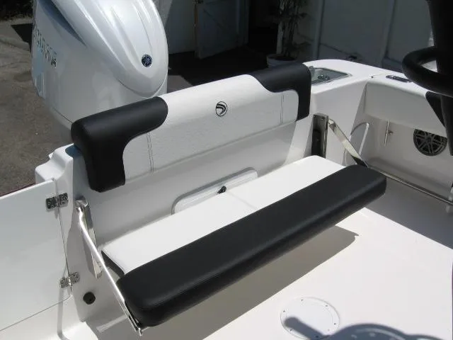 Slide: The Image of Edgewater 208 WATCHMAN CC 2025 boat seat with black and white upholstery. - 7