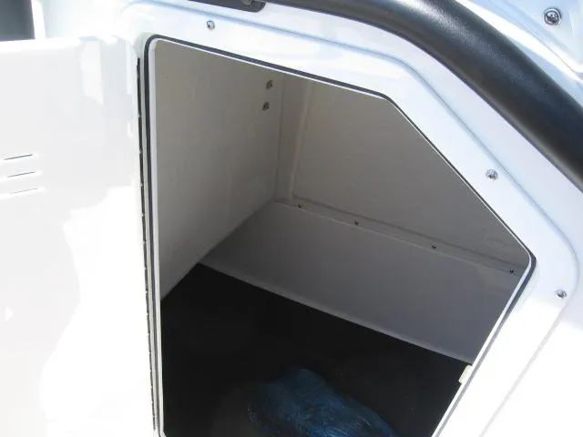 Slide: The Image of Storage compartment of 2025 Edgewater 208 WATCHMAN CC boat, featuring sleek white interior. - 9