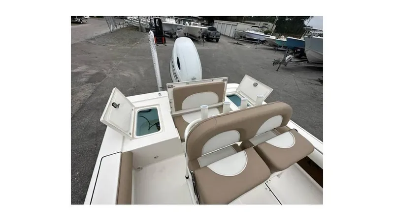 Slide: The Image of 2024 Sea Born FX22 Bay boat interior with seating and storage compartments. - 10