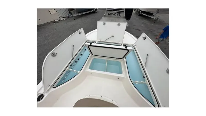 Slide: The Image of 2024 Sea Born FX22 Bay boat interior storage compartments open. - 12