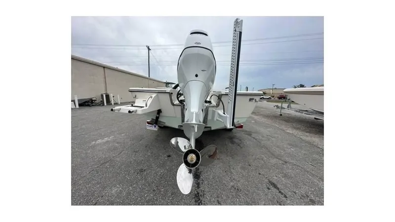 Slide: The Image of 2024 Sea Born FX22 Bay boat rear view with outboard motor. - 14