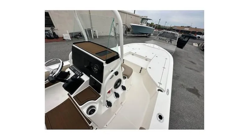 Slide: The Image of 2024 Sea Born FX22 Bay boat, white interior, docked outdoors. - 5