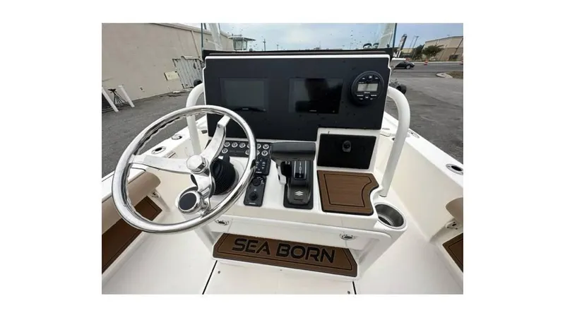 Slide: The Image of 2024 Sea Born FX22 Bay boat dashboard with steering wheel and controls. - 8