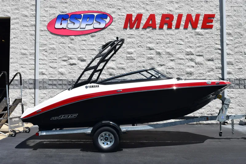 The Image of 2025 Yamaha AR195 boat on trailer at GSPS Marine dealership. - 1