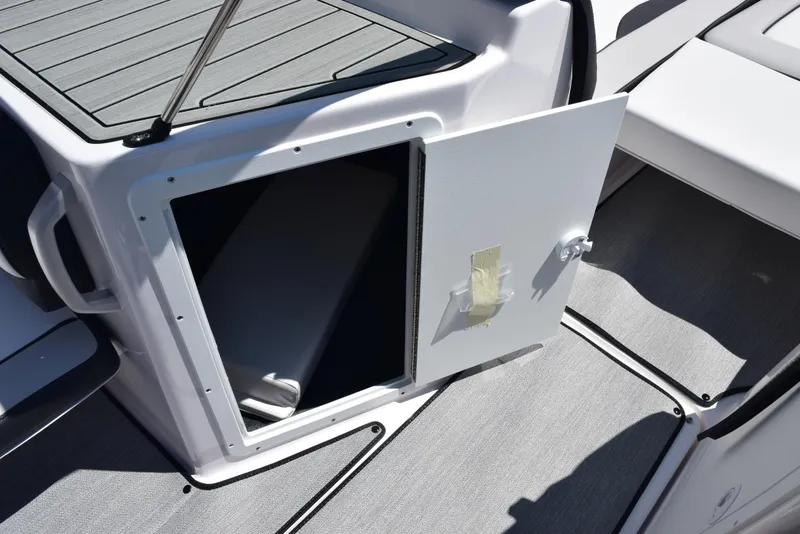 Slide: The Image of Open storage compartment on 2025 Yamaha Boats AR195, showcasing interior space and design. - 15