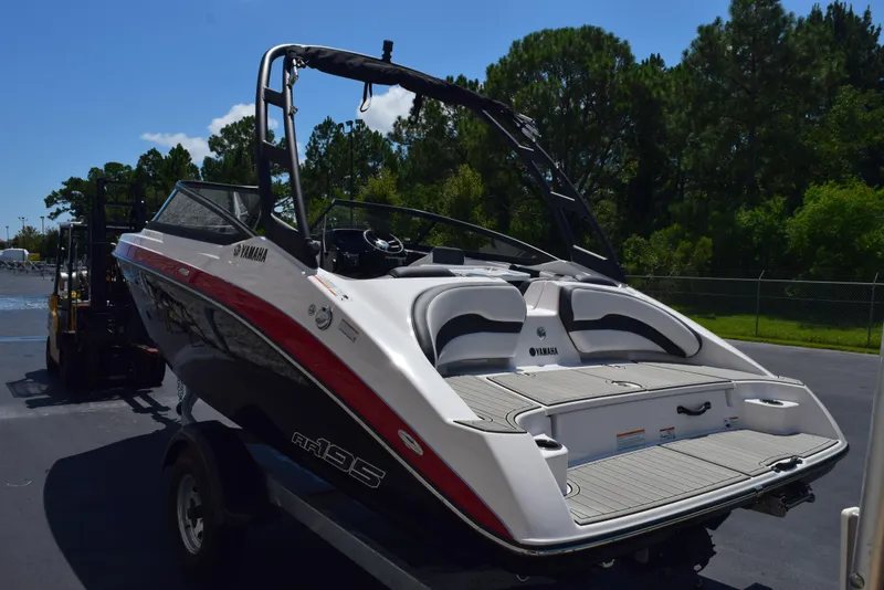 Slide: The Image of 2025 Yamaha AR195 boat on trailer, sleek design, parked outdoors. - 5