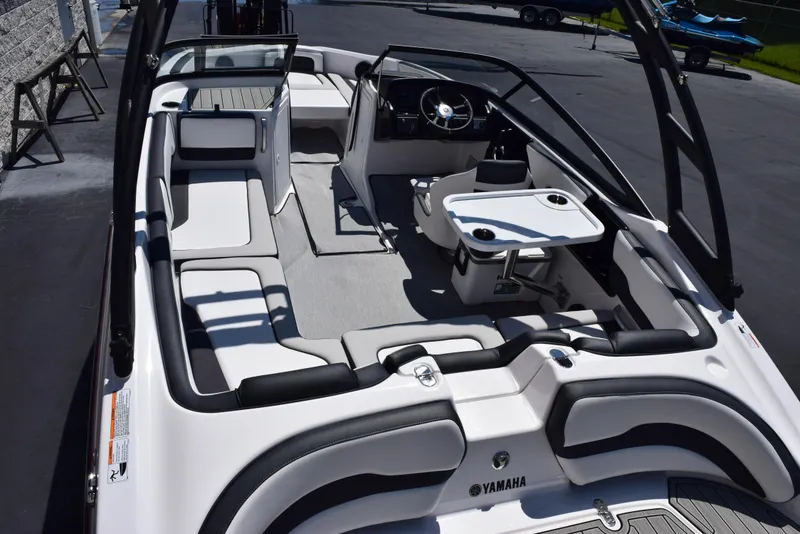 Slide: The Image of 2025 Yamaha Boats AR195 interior with sleek seating and modern dashboard design. - 6