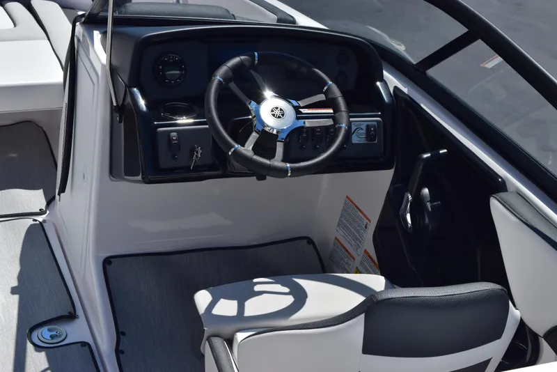 Slide: The Image of 2025 Yamaha Boats AR195 cockpit with steering wheel and control panel. - 8