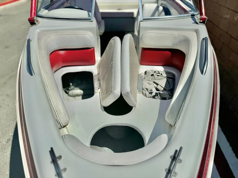 Slide: The Image of 1998 VIP Vixen boat interior with red and white seating. - 10