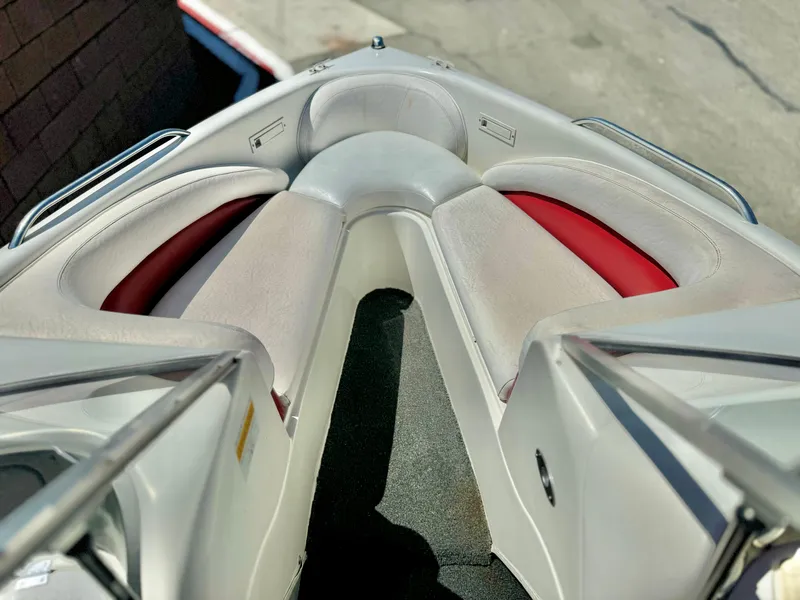 Slide: The Image of 1998 VIP Vixen boat interior with red and gray seating. - 11