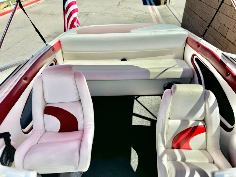 Slide: The Image of Interior of 1998 VIP Vixen boat with white and red seating. - 16