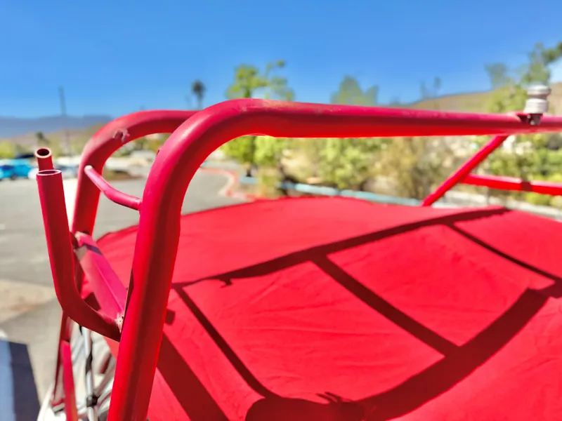 Slide: The Image of Red roof rack on 1998 VIP Vixen vehicle under clear blue sky. - 18