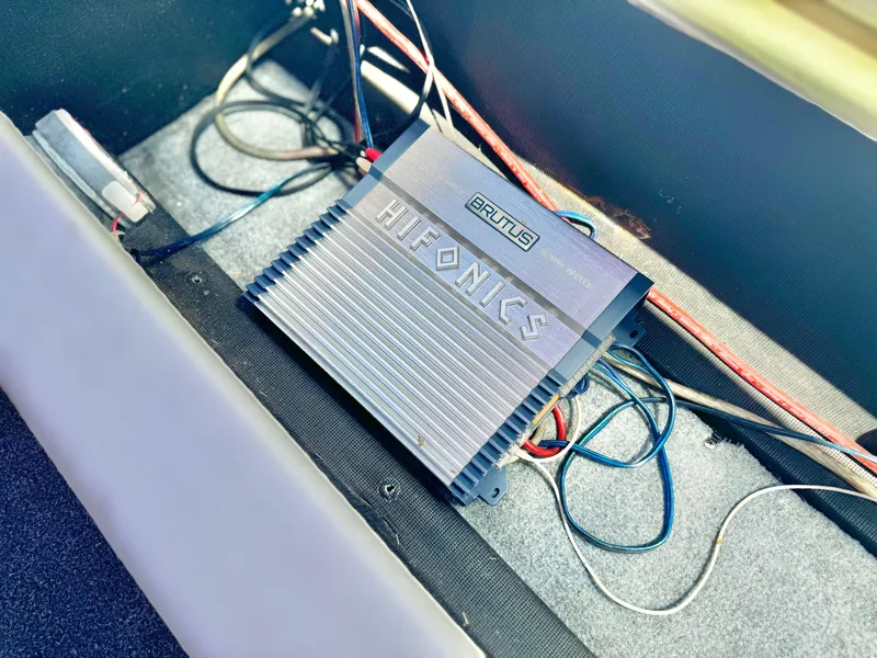 Slide: The Image of Car audio amplifier installation in a 1998 VIP Vixen, featuring Hifonics Brutus model. - 20