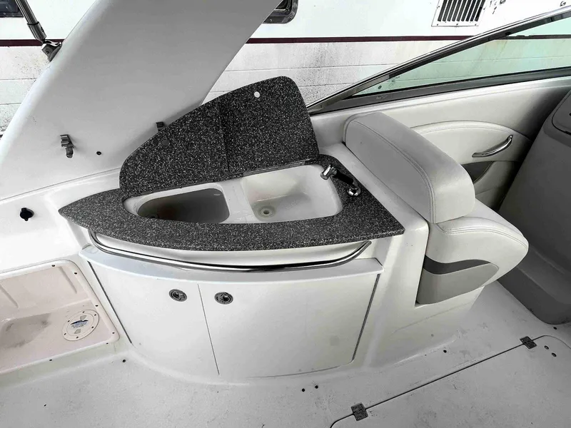 Slide: The Image of 2007 Chaparral 275 SSi boat interior with sink and seating area. - 10
