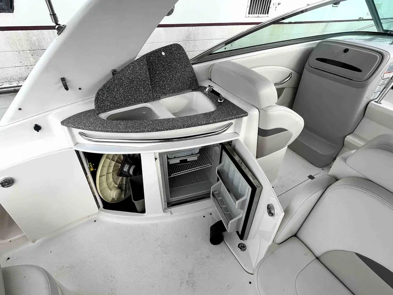 Slide: The Image of 2007 Chaparral 275 SSi boat interior with open storage and seating area. - 11