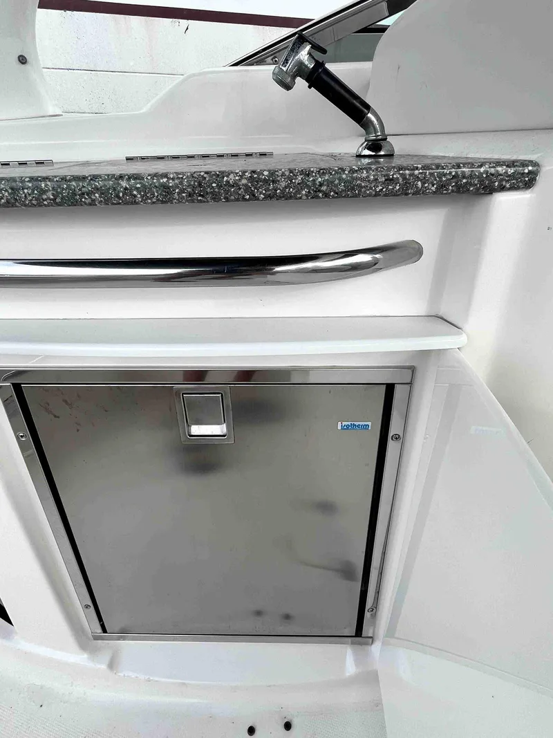 Slide: The Image of 2007 Chaparral 275 SSi boat interior with stainless steel cabinet and countertop. - 12