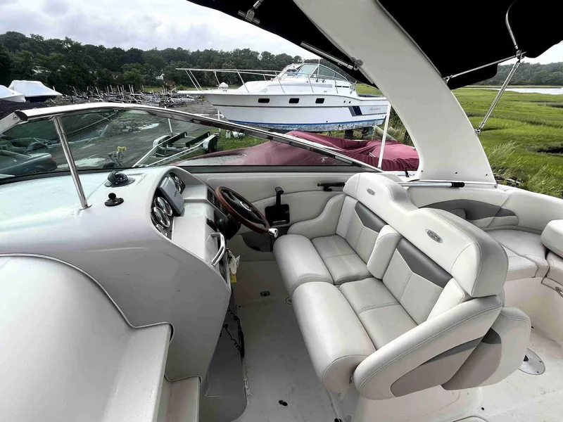 Slide: The Image of 2007 Chaparral 275 SSi boat interior with white leather seating and steering wheel. - 15
