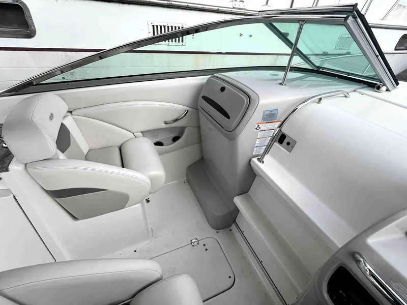 Slide: The Image of Interior of 2007 Chaparral 275 SSi boat with white seating and dashboard. - 16