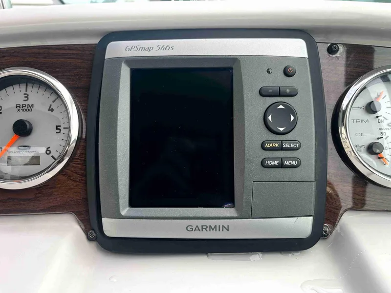 Slide: The Image of Garmin GPSmap 546s on 2007 Chaparral 275 SSi dashboard with RPM and oil gauges. - 20