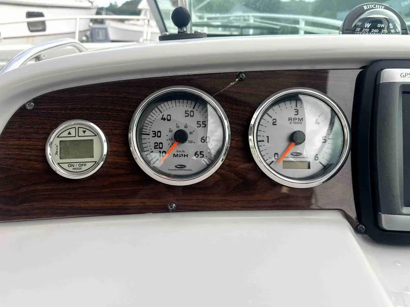 Slide: The Image of Dashboard of 2007 Chaparral 275 SSi boat with speedometer and tachometer. - 21