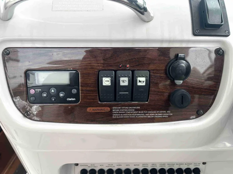 Slide: The Image of Control panel of 2007 Chaparral 275 SSi boat with switches and Clarion audio system. - 22