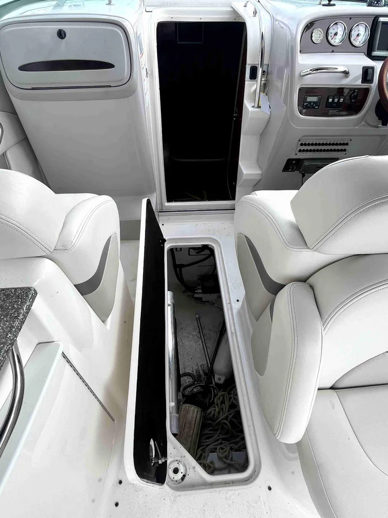 Slide: The Image of Interior of 2007 Chaparral 275 SSi boat with open storage compartment. - 25