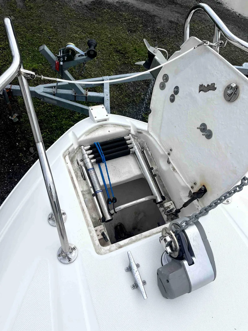 Slide: The Image of 2007 Chaparral 275 SSi boat anchor compartment with open hatch and winch. - 31