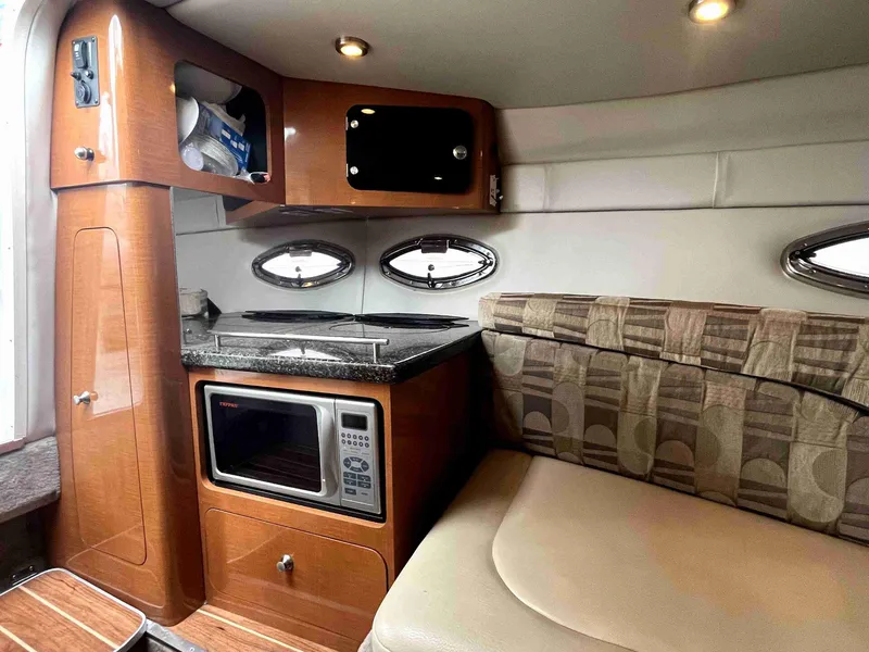 Slide: The Image of 2007 Chaparral 275 SSi cabin interior with kitchenette and seating area. - 36