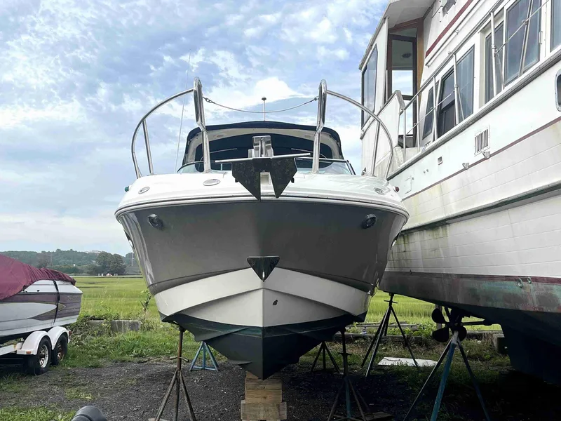 Slide: The Image of 2007 Chaparral 275 SSi boat on stands, side view, cloudy sky background. - 4