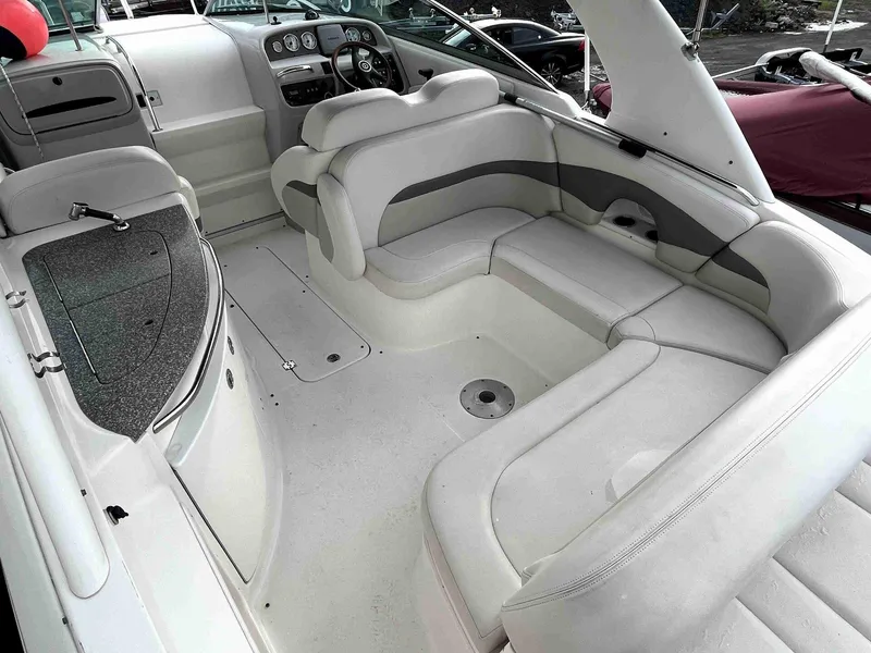 Slide: The Image of 2007 Chaparral 275 SSi boat interior with white seating and dashboard. - 8