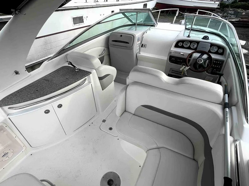 Slide: The Image of Interior of 2007 Chaparral 275 SSi boat with white seating and dashboard. - 9