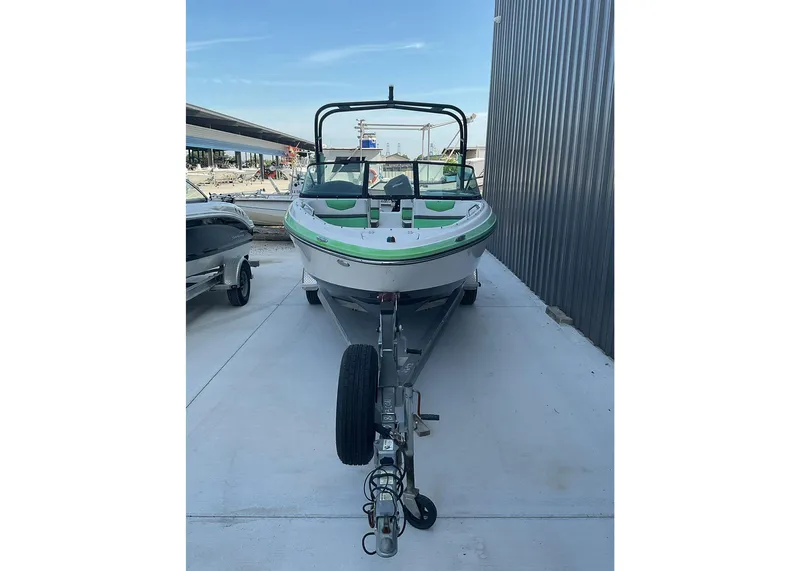 Slide: The Image of 2016 Chaparral Vector 203 boat on trailer, parked outdoors. - 4