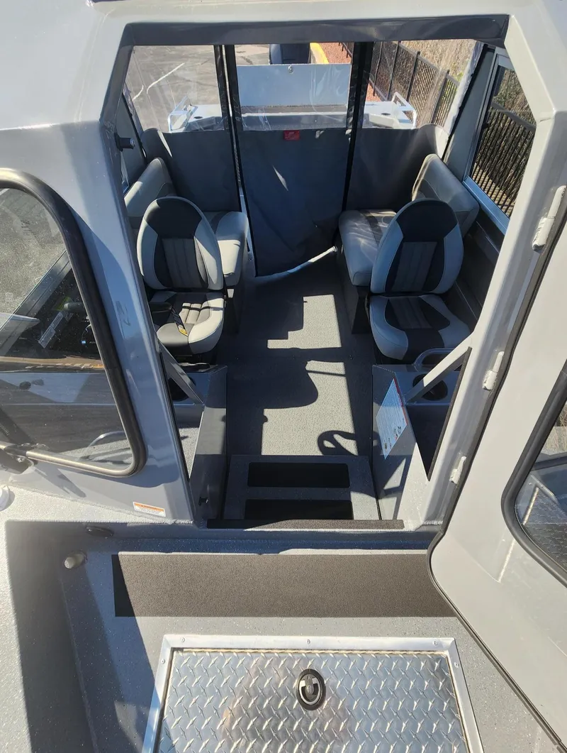 Slide: The Image of Interior of 2025 Spartan 200 Astoria boat with seating and modern design. - 7