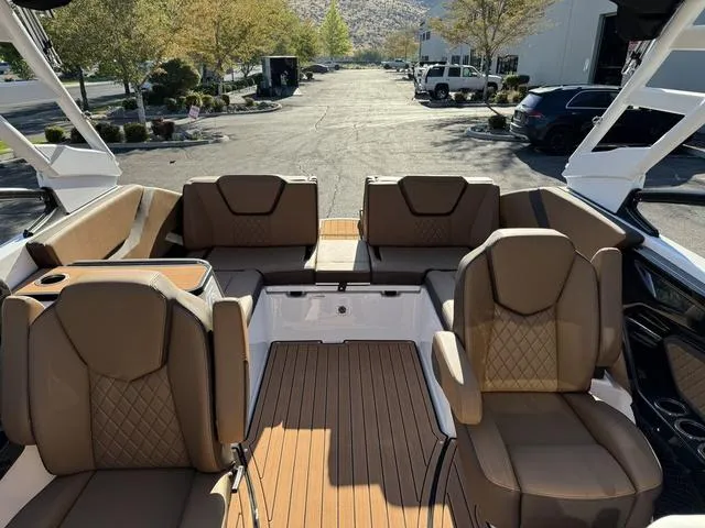 Slide: The Image of 2024 Yamaha Boats 252S interior with brown seating and spacious layout. - 4