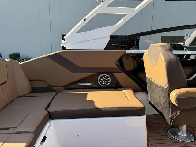 Slide: The Image of 2024 Yamaha Boats 252S interior with tan seating and modern design. - 6