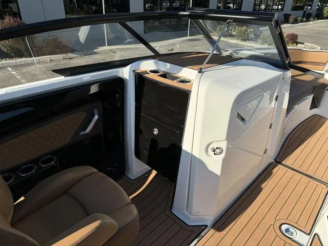 Slide: The Image of 2024 Yamaha Boats 252S interior with sleek design and wood accents. - 7